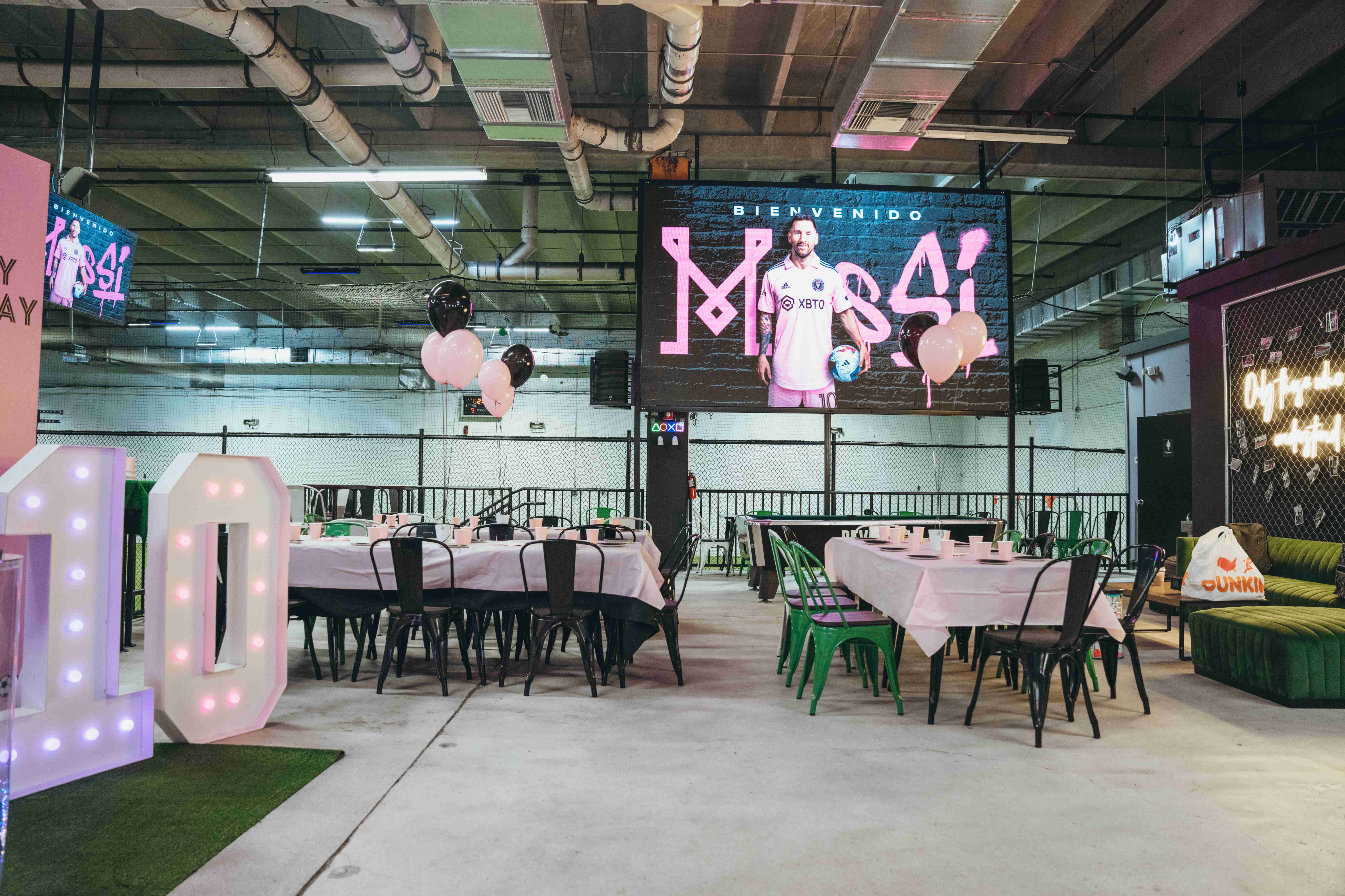 Soccer themed party setup with tables and decorations